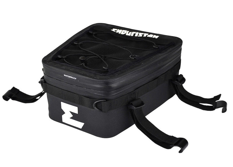 A black Enduristan motorcycle tank bag with a zippered top, front buckle strap, and side straps, shown on a plain white background.